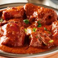 Lamb Tikka Masala · Tender pieces of marinated lamb cooked in a rich and creamy tomato gravy.