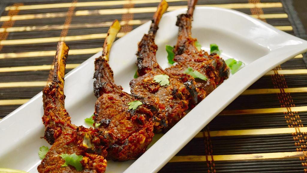 Lamb Chops · Lamb chop marinated overnight in yogurt and spices and cooked in tandoor oven.