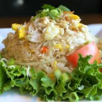Crabmeat Fried Rice · Thai jasmine rice combined with crab meat, egg, carrot, tomato, onion, and scallion sautéed ...