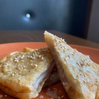 Sweet Taro Roti(New) · Sweet taro paste in Roti pancake top with Condensed milk and
Sesame seed