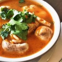 Tom Yum* · Spicy. Traditional Thai style hot and sour lemongrass soup with mushroom tomato and cilantro...