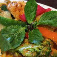 Red Curry · Medium spicy. Choice of meat in Thai red curry with Thai eggplant, bell pepper, bamboo shoot...