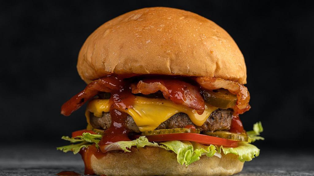 Exotic Bacon Cheeseburger · Finest burger cooked with 1/3lb beef patty, crispy bacon strips, lettuce, tomatoes, pickles, mayonnaise and mustard.