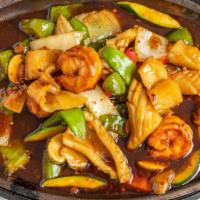 Sizzling Seafood Platter · Shrimp, scallop, squid, crabmeat, Asian vegetable, garlic wine sauce.