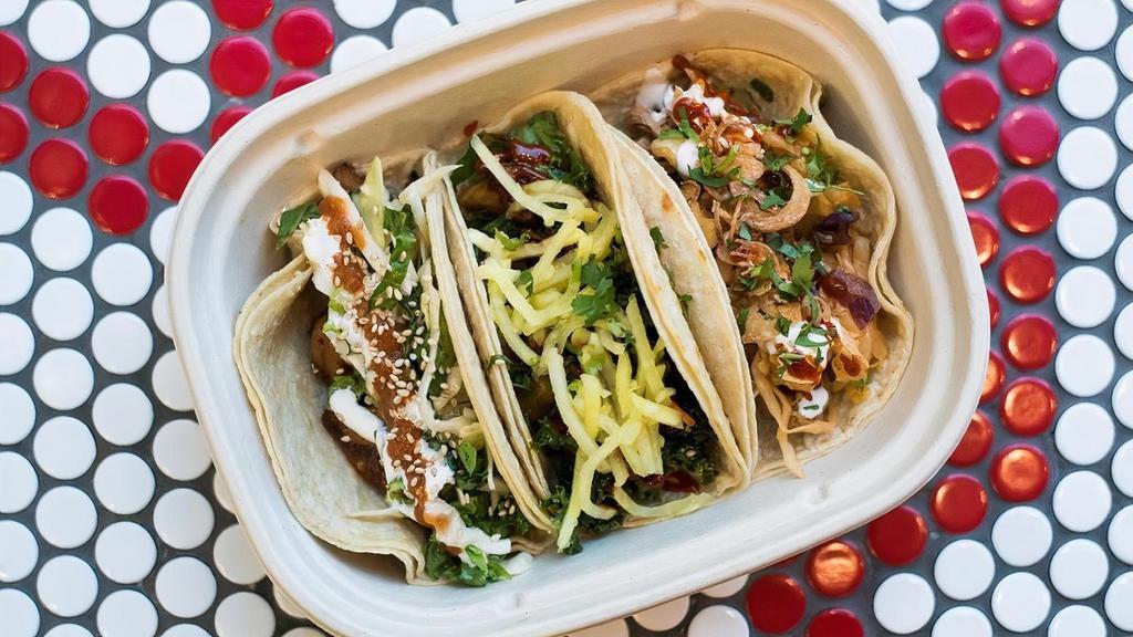 3 Tacos · Soft corn tortillas, includes choice of slaw & toppings.