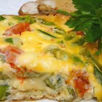 Asparagus Omelet · with tomato, spinach, sautéed onion, and cheddar cheese, served with home fries and toasted ...