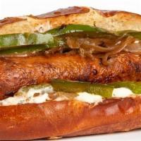 - 12) Pretzel Sausage · Beyond Meat Brat sauteed onions and peppers with drizzle of garlic herb aioli served on a pr...
