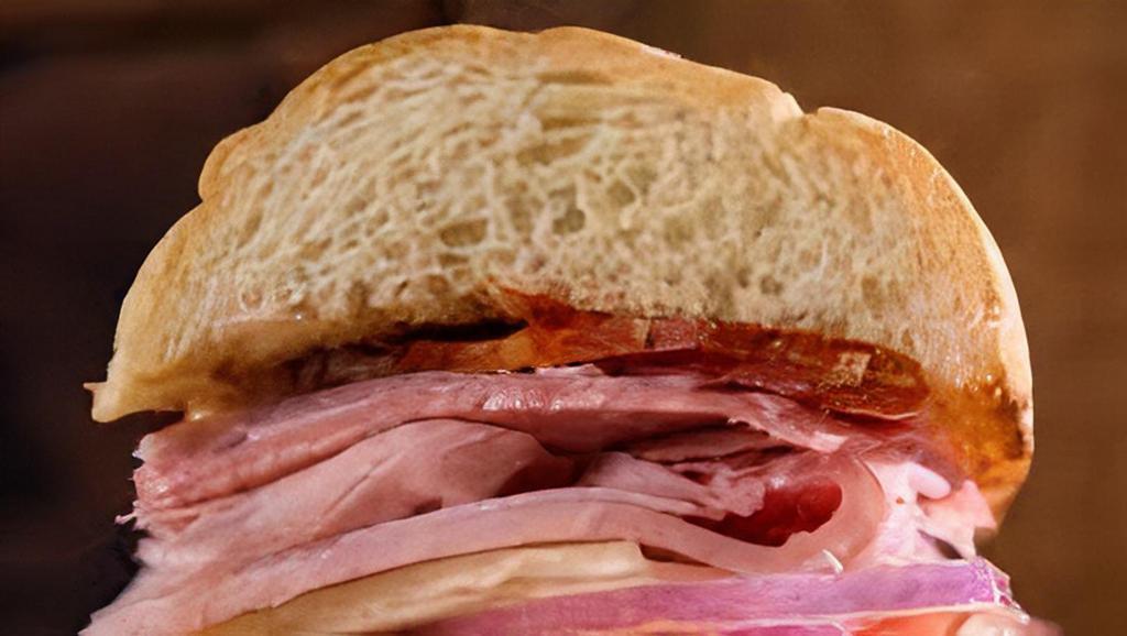 Ham & Swiss · Ham, bacon, swiss, lettuce, tomato red onion, mayo dijon mustard, on marble rye bread.