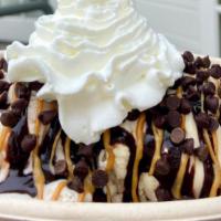 Cheeky Monkey Sundae · Banana chocolate chunk and peanut butte cup ice cream topped with hot fudge, peanut butter s...