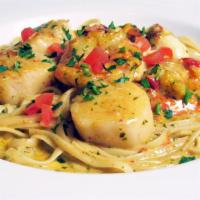 Fettucini Pescatore · shrimp and scallops simmered in a sundried tomato-pesto cream sauce over fresh fettucini pas...
