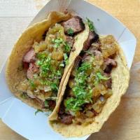 Carne Asada Tacos · 3 steak tacos, served with a sweet onion & lime salsa, all served on our fresh masa tortillas.