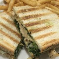 Grilled Florentine Panini · Grilled chicken breast, spinach, provolone, creamy pesto mayonnaise, and baby lettuce.