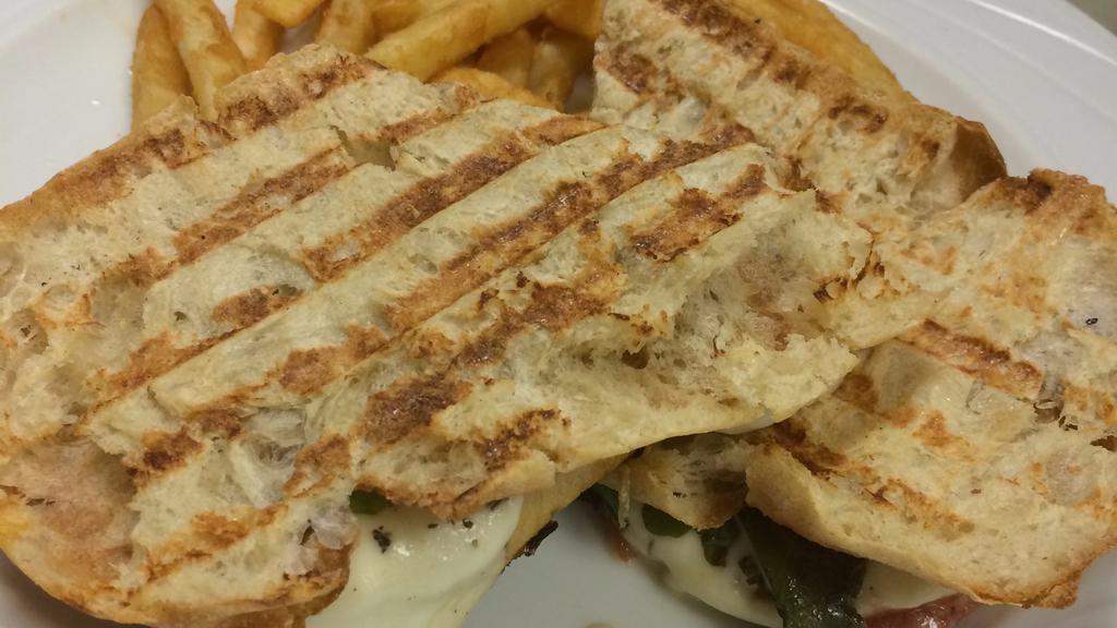 Grilled Sausage Panini · Grilled Italian sausage, minced garlic, fresh spinach, provolone olive oil, and Italian seasoning.