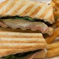 Grilled Toscani Panini · Thinly sliced prosciutto ham, fresh mozzarella, extra virgin olive oil, and baby lettuce.