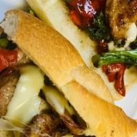 Sausage San Remo Sub · Grilled mild Italian sausage with broccoli rabe, roasted peppers, and mozzarella.