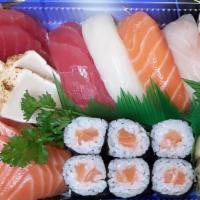 Sushi And Sashimi Plate · Seven sashimi, five pieces sushi, tuna roll.