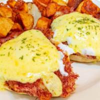 The Looking Glass Benedict · Homemade corned beef/ two eggs on a English muffin topped with hollandaise.