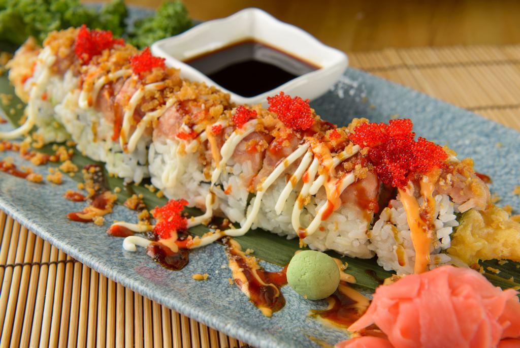 Volcano Roll · Raw. Spicy tuna, crab salad, shrimp, avocado, tempura flakes, Sriracha, unagi sauce and red tobiko.