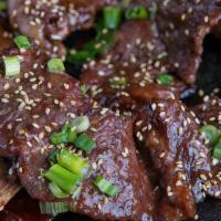 Galbi Korean Bbq · Korean style bone-in short ribs, soy sauce and brown sugar marinade, pickled daikon radish, ...