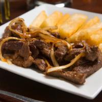 Picanha Na Chapa · Juicy sirloin beef, served with crispy yucca or fries.