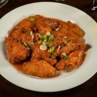 Buffalo Chicken Wings · Tasteful Buffalo chicken wings, served with blue cheese on the side.