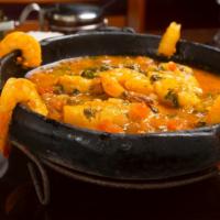 Muqueca De Camarão · Shrimp muqueca. Succulent shrimp stew simmered with tomatoes, onions, garlic, dendê oil, fre...