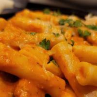 Penne A La Vodka With Salad · Penne pasta with our homemade delicious vodka cream sauce. Comes with salad. Served with fre...