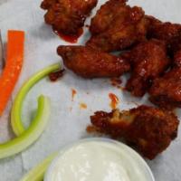 Chicken Wings · Dipping sauce included. served with a choice of flavor.