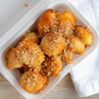 Loukoumades (15 Pieces)  · light fluffy donut puffs drenched in honey sauce topped with chopped walnut and cinnamon  15...