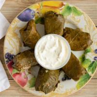 Dolmades (6) · Grape leaves stuffed with rice and beef mixture.