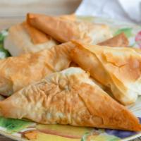 Tyropita (6) · Cheese puffs wrapped in phyllo.