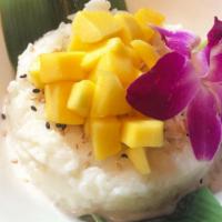 Mango Sticky Rice · Sweet Coconut rice, ripe mangos, and crispy coconut flakes.
