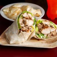 Grilled Chicken Caesar Wrap · Grilled chicken, romaine lettuce, shaved Parmesan cheese, onions, and caesar dressing.