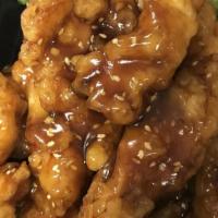 Sesame Chicken · Strips of selected white meat chicken lightly battered and toss fried with our chef’s specia...