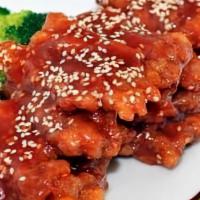 Sesame Beef · Tender thing sliced flank steak toss fried with our chef’s special tangy sesame sauce.