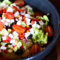 Chopped Salad · Roasted corn, black beans, peppers, onions, jicama, tomatoes, greens, lemon and lime vinaigr...