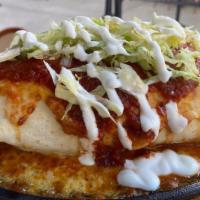 Smothered Burrito · Carne asada, chorizo, red rice, pinto beans, shaved lettuce, SB blend cheese, salsa roja, Co...