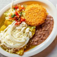 Green Enchiladas Platter · Three soft corn tortillas filled with chicken and topped with green sauce, fresh cheese, oni...