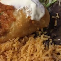 Chimichangas Platter · Two small fried burritos filled with chicken and cheese, served with rice, beans, lettuce an...