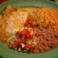 Mole Enchiladas Platter · Three soft corn tortillas filled with chicken and topped with mole sauce, fresh cheese, onio...