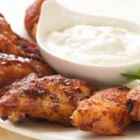 Cajun Chicken Wings · Deep fried chicken wings tossed in zesty and spicy Cajun seasoning.