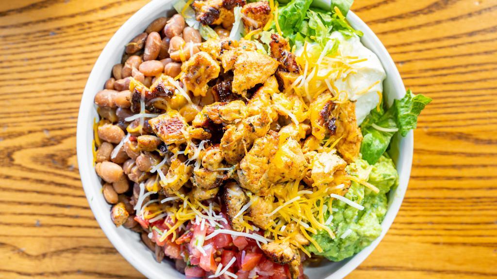 Burrito Bowls · Served with rice, beans, lettuce,
pico de gallo, sour cream,
guacamole, jack cheese and
hot sauce. Add protein for
additional charge