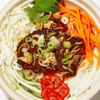 Short Rib Bowl · served with fresh shaved and pickled veggies, fresh herbs, crispy onion, crushed peanut, and...
