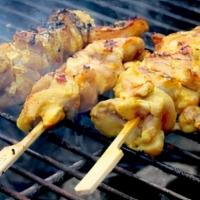 Chicken Satay · Grilled chicken on skewer marinated in coconut base spices served with cucumber salad and Th...