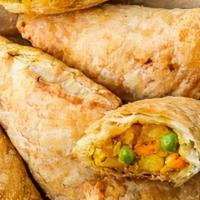 Curry Puff · Thai traditional vegetable puff with curry powder, serve with cucumber salad. Dish can be ma...