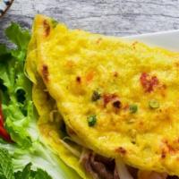 Banh Xeo (Vietnamese Crepe) · Mixture of shrimp and bean sprout folded in a rice powder pancake served with fresh watercre...