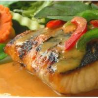Salmon Red Sea · Spicy. Gluten-free. Grilled salmon fillet in red curry, bell peppers, shredded lime leaves s...
