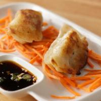 Crab & Pork Dumplings · Pan fried or steamed with minced pork, cabbage, water chestnuts, and lump crabmeat served wi...