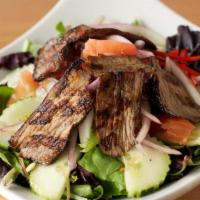 Thai Beef Salad · Grilled beef with tomatoes, cucumbers, peppers, onions, and scallions tossed with lime vinai...