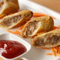 Cheesesteak Spring Roll · Rib eye steak and sautéed onions with American cheese.